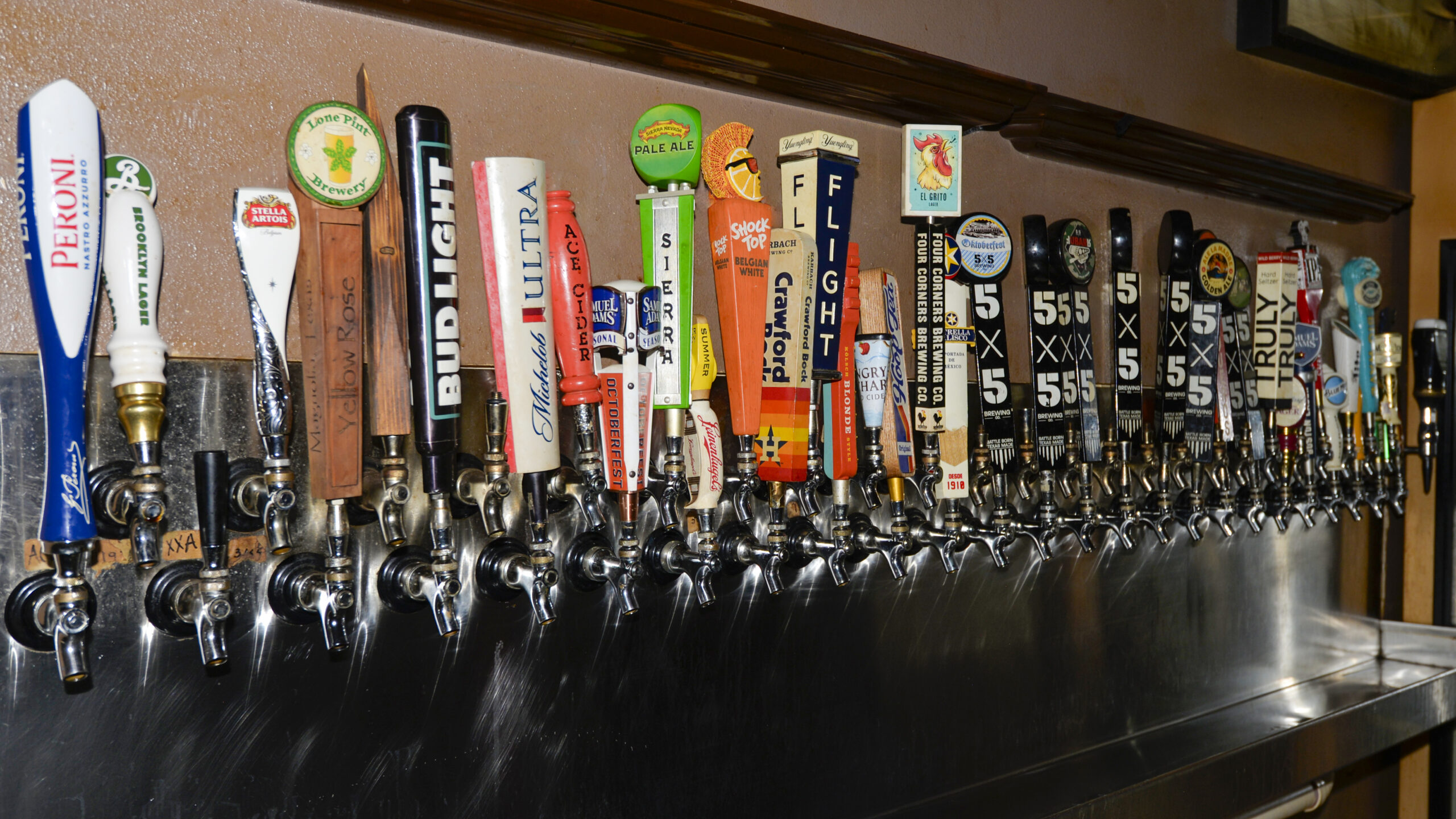 Torpedo Bar interior at Casa Petrides Tobaccos McAllen Texas — craft beers on tap